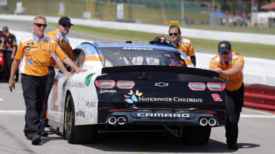 The RCR road crew pushes Tyler Reddick's No. 2 Nationwide Children's Hospital Chevrolet onto the starting grid, where Reddick rolled off 10th.
