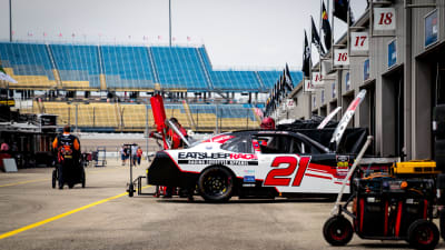Joe Graf Jr. brings his No. 21 Eat Sleep Race Chevrolet to the attention of his team after his first practice run.