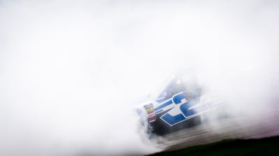 The vibrant No. 2 KC Motorgroup Chevrolet emerges from the smoke created by Tyler Reddick&apos;s celebratory spin.