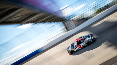 Tyler Reddick's No. 2 Freightliner Chevrolet races off Turn 2 and under the pedestrian bridge during practice at Dover.