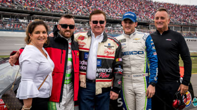 The Dillon family poses with patriarch Richard Childress before he climbs in Dale Earnhardt's No. 3 GM Goodwrench Chevrolet for pace laps prior to Sunday's race at Talladega Superspeedway.