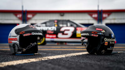 A pair of Dale Earnhardt's helmets sit in front of his No. 3 GM Goodwrench Chevrolet after completing the pace laps Sunday at Talladega Superspeedway.
