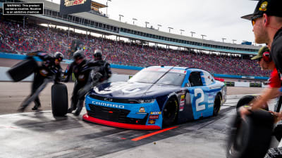 The No. 2 crew goes to work around to the left side of Tyler Reddick's Chevrolet during a stage break in Saturday's Xfinity Series race at ISM Raceway.