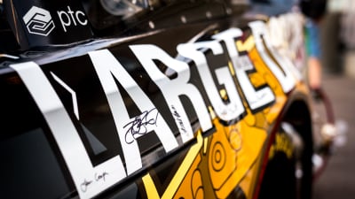 The right side of Daniel Hemric's No. 8 Cat Large Dozers Chevrolet features autographs from Cat Mining customers.