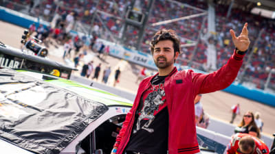 YouTube celebrity Hooman records a video in front of Austin Dillon's No. 3 American Ethanol Chevrolet before Sunday's race at ISM Raceway.