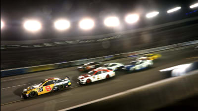 Daniel Hemric's No. 8 Caterpillar Chevrolet leads a pack of cars into the corner during Saturday night's Cup race at Richmond Raceway.