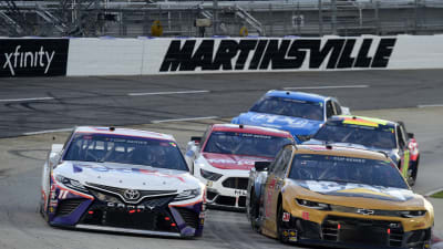 MARTINSVILLE, VIRGINIA - JUNE 10: Denny Hamlin, driver of the #11 FedEx Freight Toyota, and Tyler Reddick, driver of the #8 Cat Fleet Monitoring Chevrolet, lead the field during the NASCAR Cup Series Blue-Emu Maximum Pain Relief 500 at Martinsville Speedway on June 10, 2020 in Martinsville, Virginia. (Photo by Jared C. Tilton/Getty Images) | Getty Images