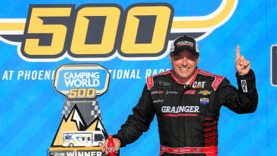 Ryan Newman poses with the trophy after winning at Phoenix Raceway in the No. 31 Grainger Chevrolet.