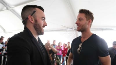 Austin Dillon talks with 'This Is Us' star, Justin Hartley, during the drivers meeting.