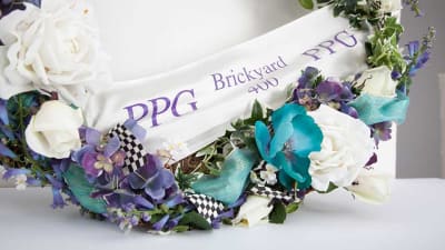 Dale Earnhardt captured the second-ever NASCAR race at Indianapolis Motor Speedway on August 5, 1995. When he entered Victory Lane, a wreath was placed on the hood of his car as tradition at IMS.