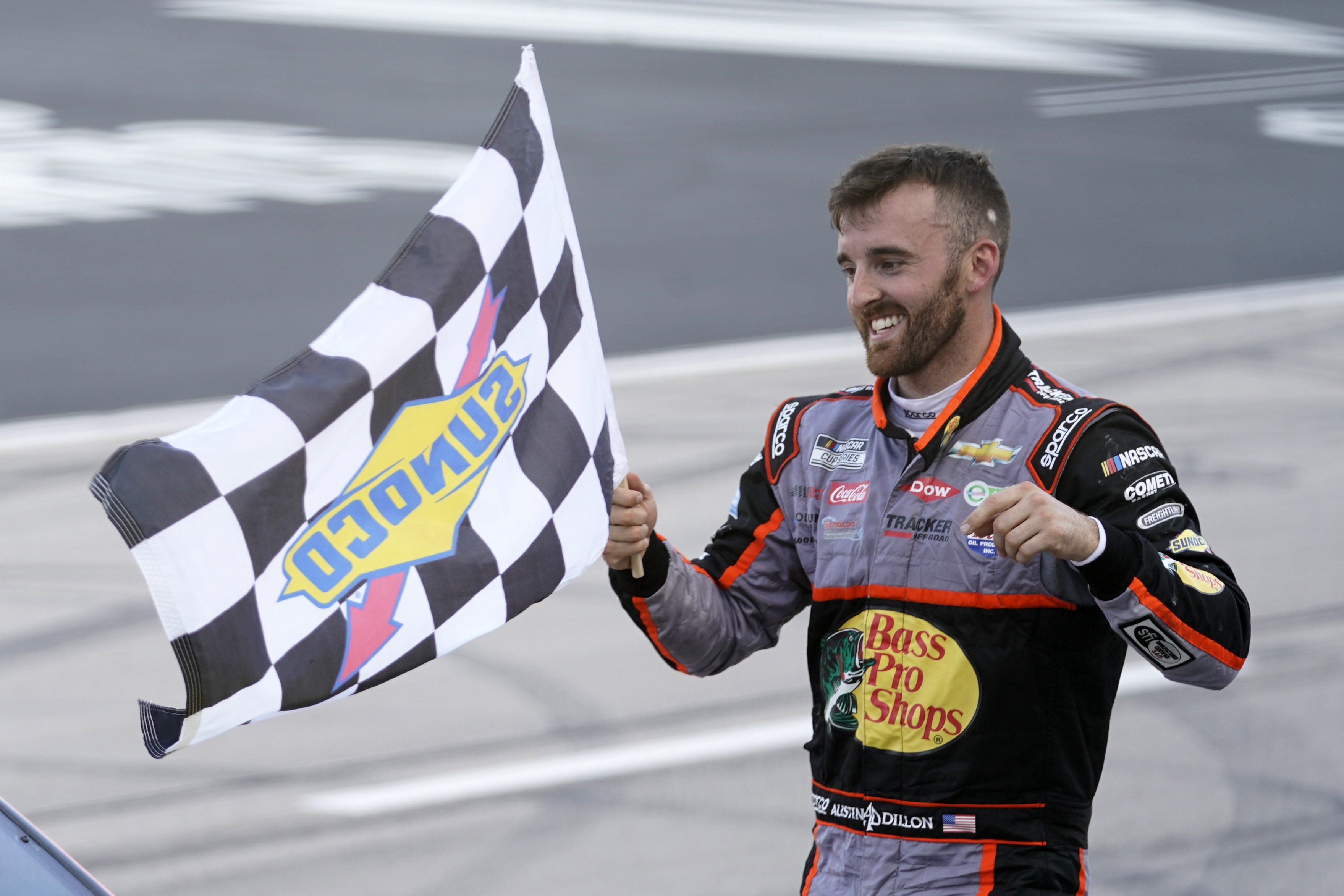 FORT WORTH, TEXAS - JULY 19: Austin Dillon, driver of the #3 Bass Pro Shops Chevrolet, celebrates with the checkered flag after winning the NASCAR Cup Series O