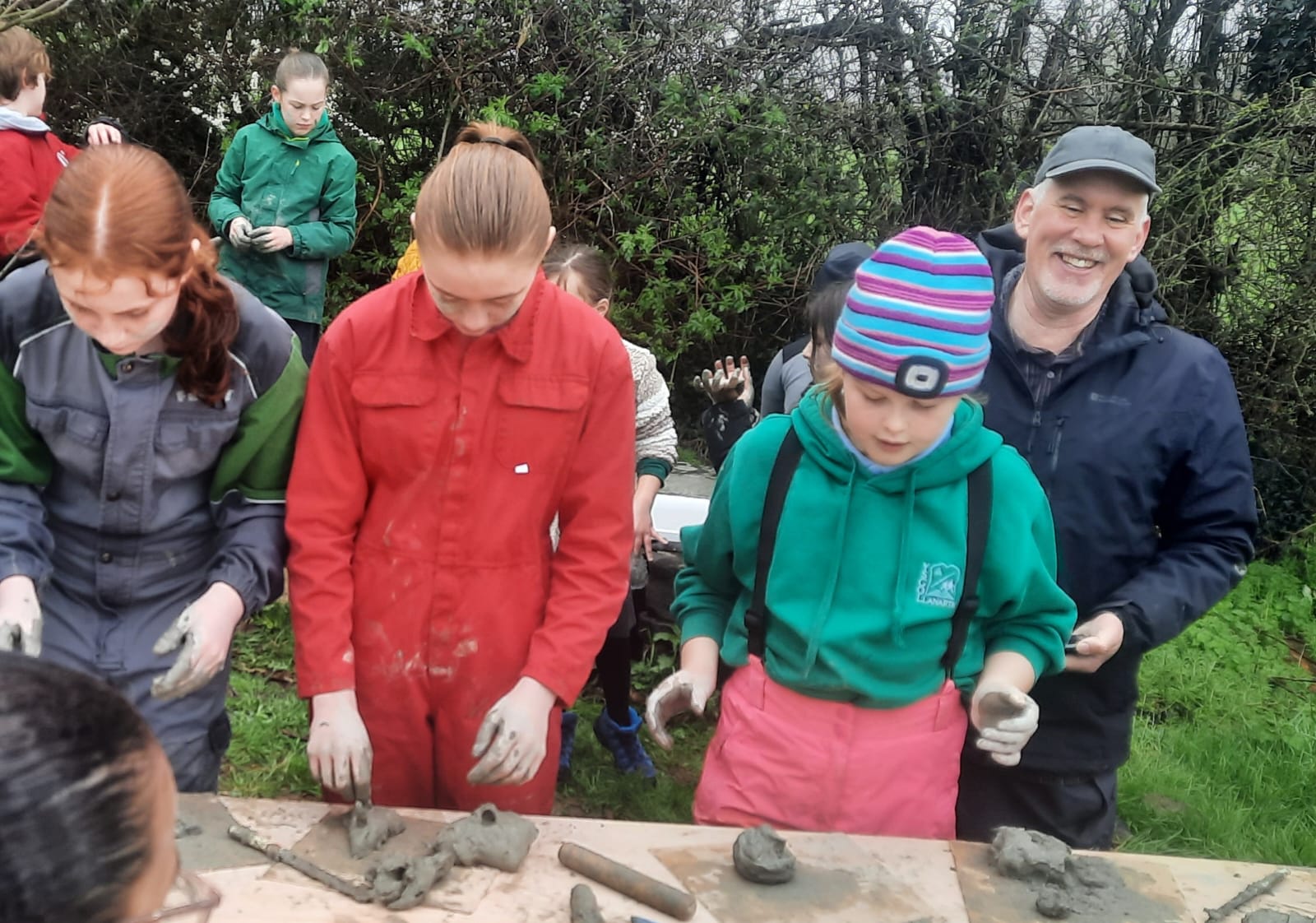 Biodiversity Assistant Jake Rayson helping with at the clay making table