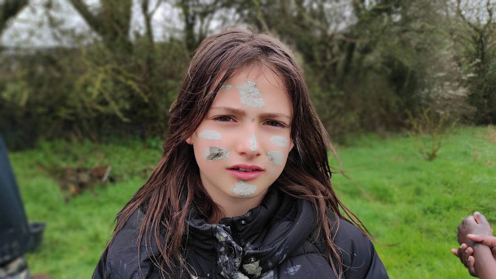 Student with clay markings