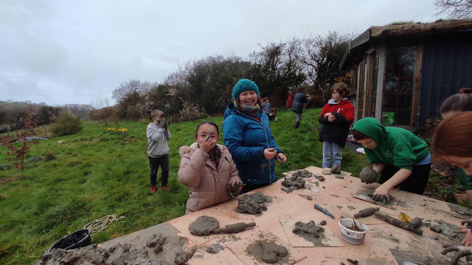 Forest School practitioner Jo Dainty very hands at the clay making table