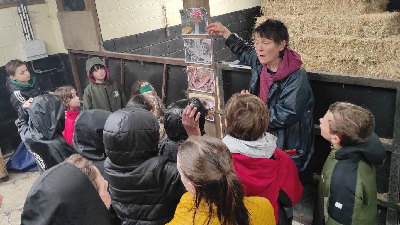 Artist Molly Gilbert talking about biodiversity and the soil.