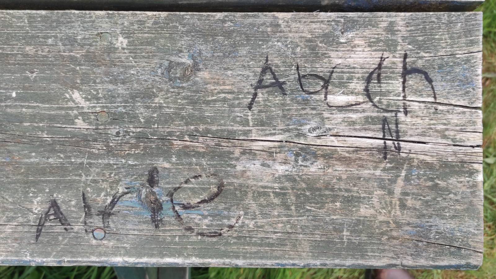 Students trying out the charcoal on the table.
