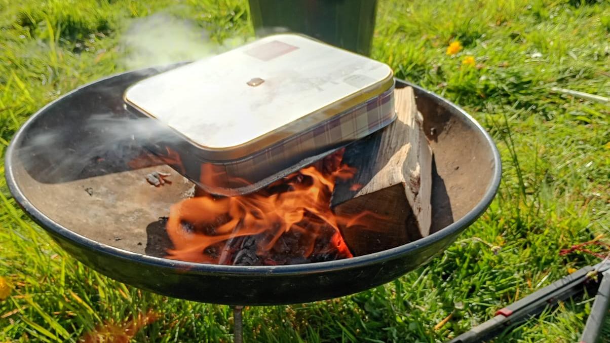 Willow stick tin on the fire, and left on a slow burn for a couple of hours.