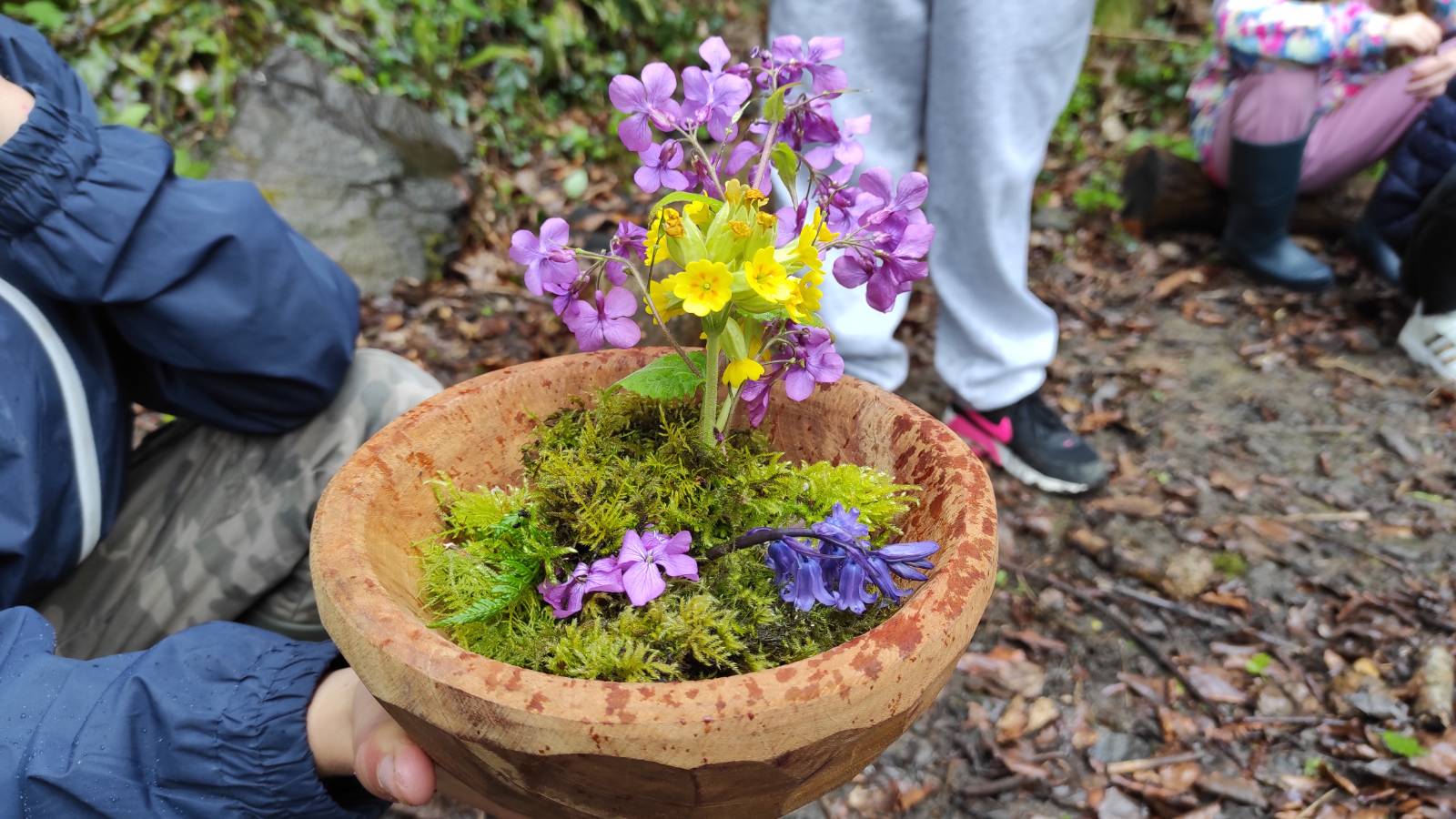 Rebecca’s bowl artfully filled with moss, Honesty and Cowslip flowers.