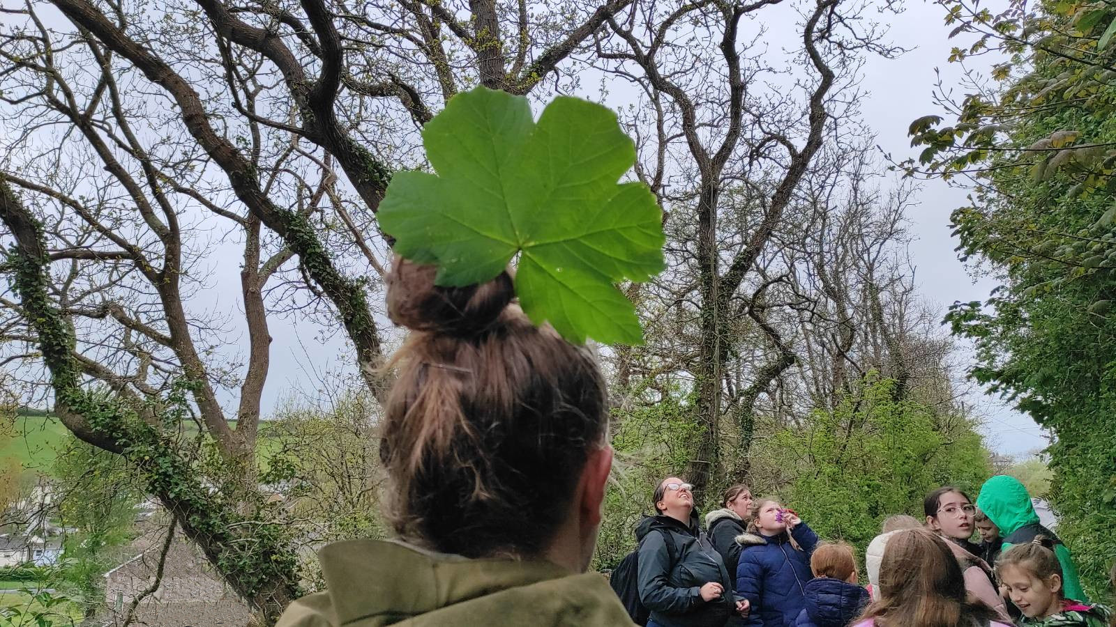Rebecca with leaf in hair on the way back to the school.