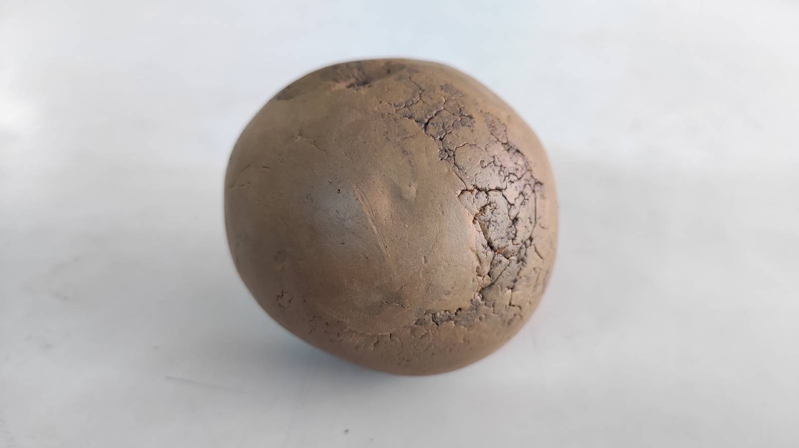 Smooth clay ball.