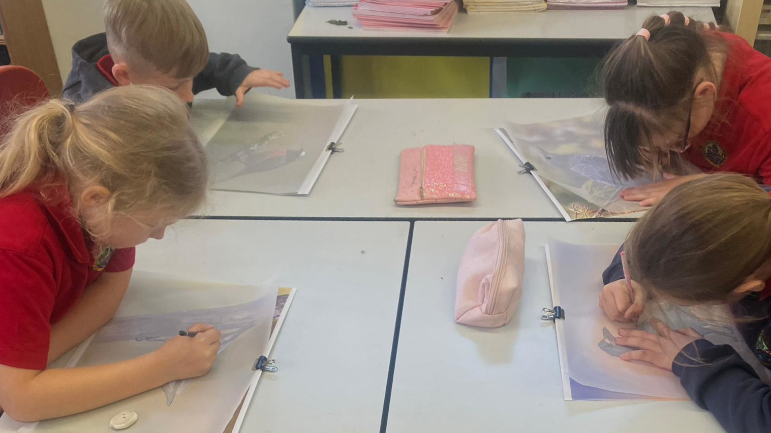 Students tracing the outline of birds.