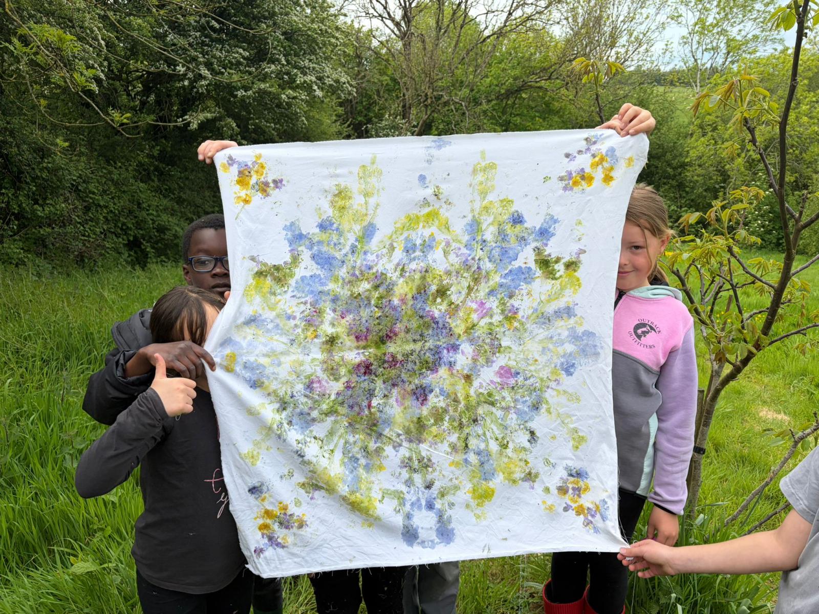 Holding up the flower print press!