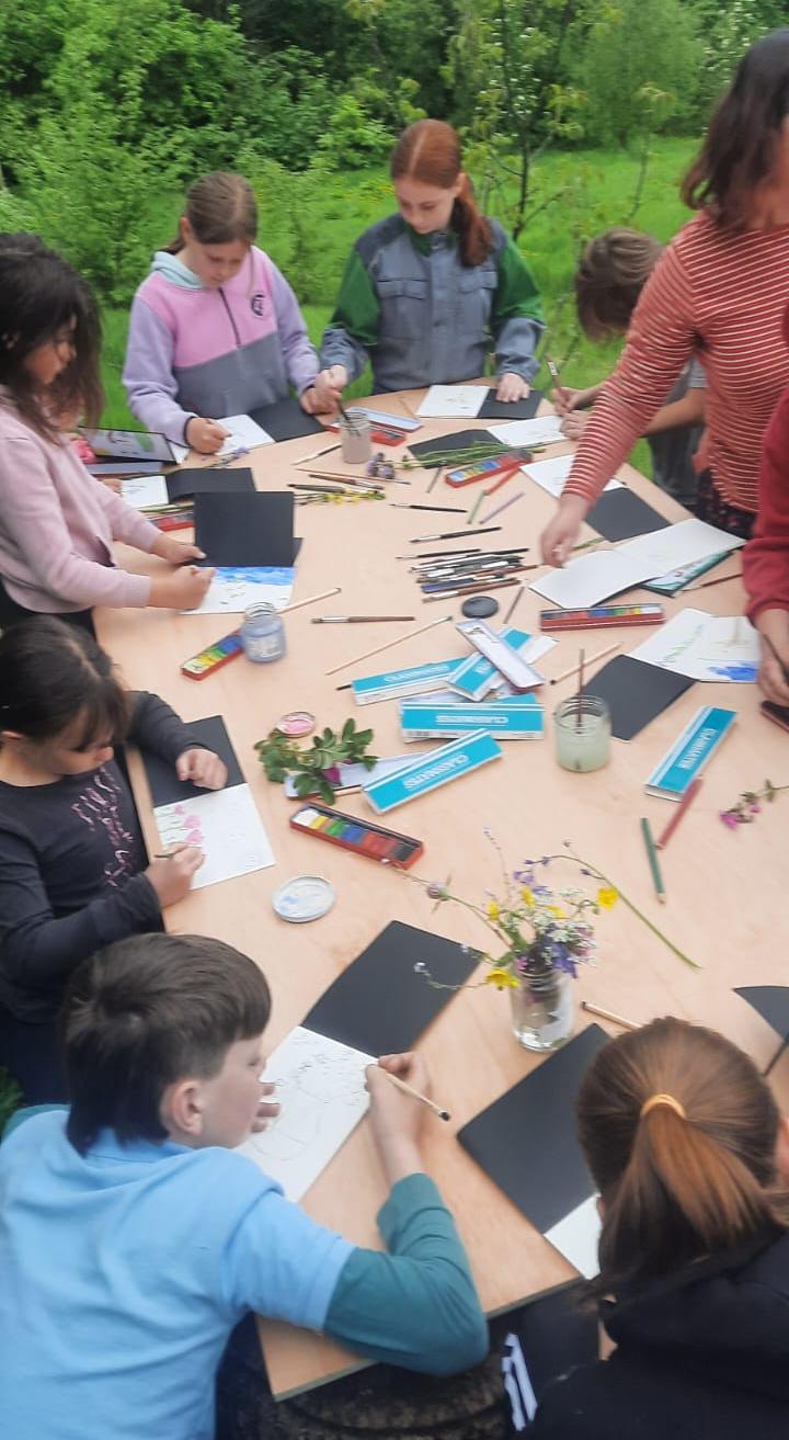 The painting table, with students and Jo