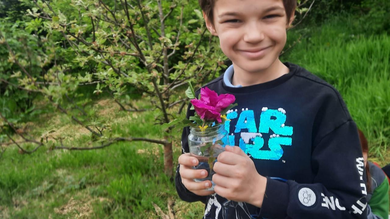 Smiling with a rose
