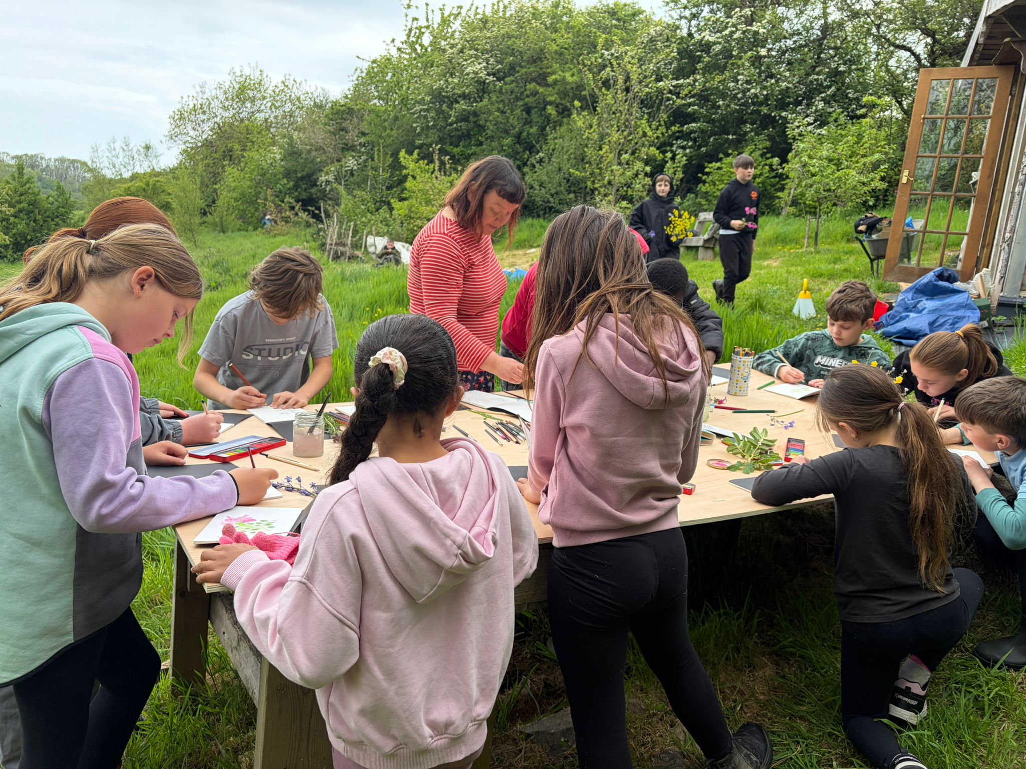 Student outdoor art table, painting flowers with Jo