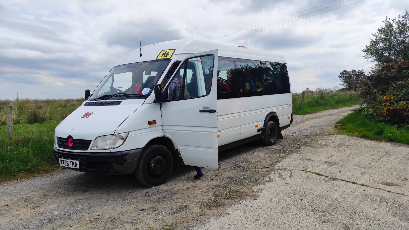 Minibus on a track, to pick up the students