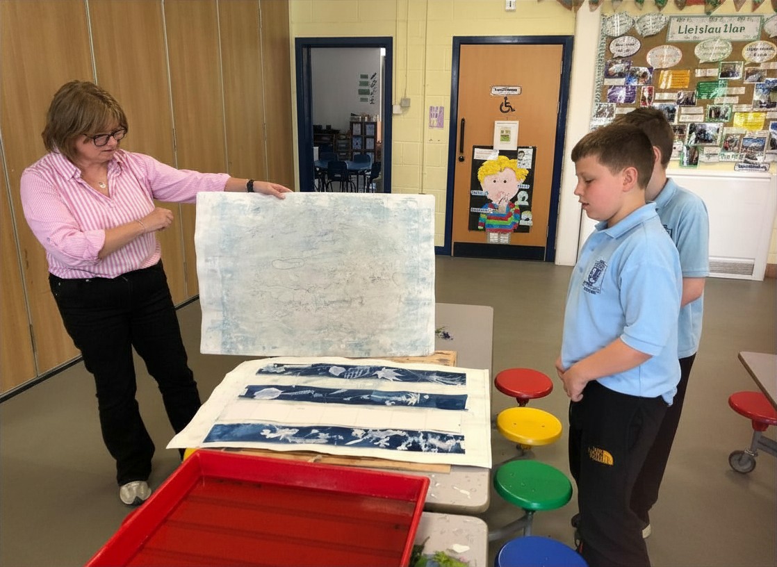 Admiring the drying prints