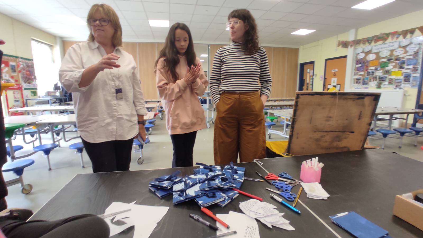 Headteacher Jannette Jones, student and artist Marian Haf viewing finished work!