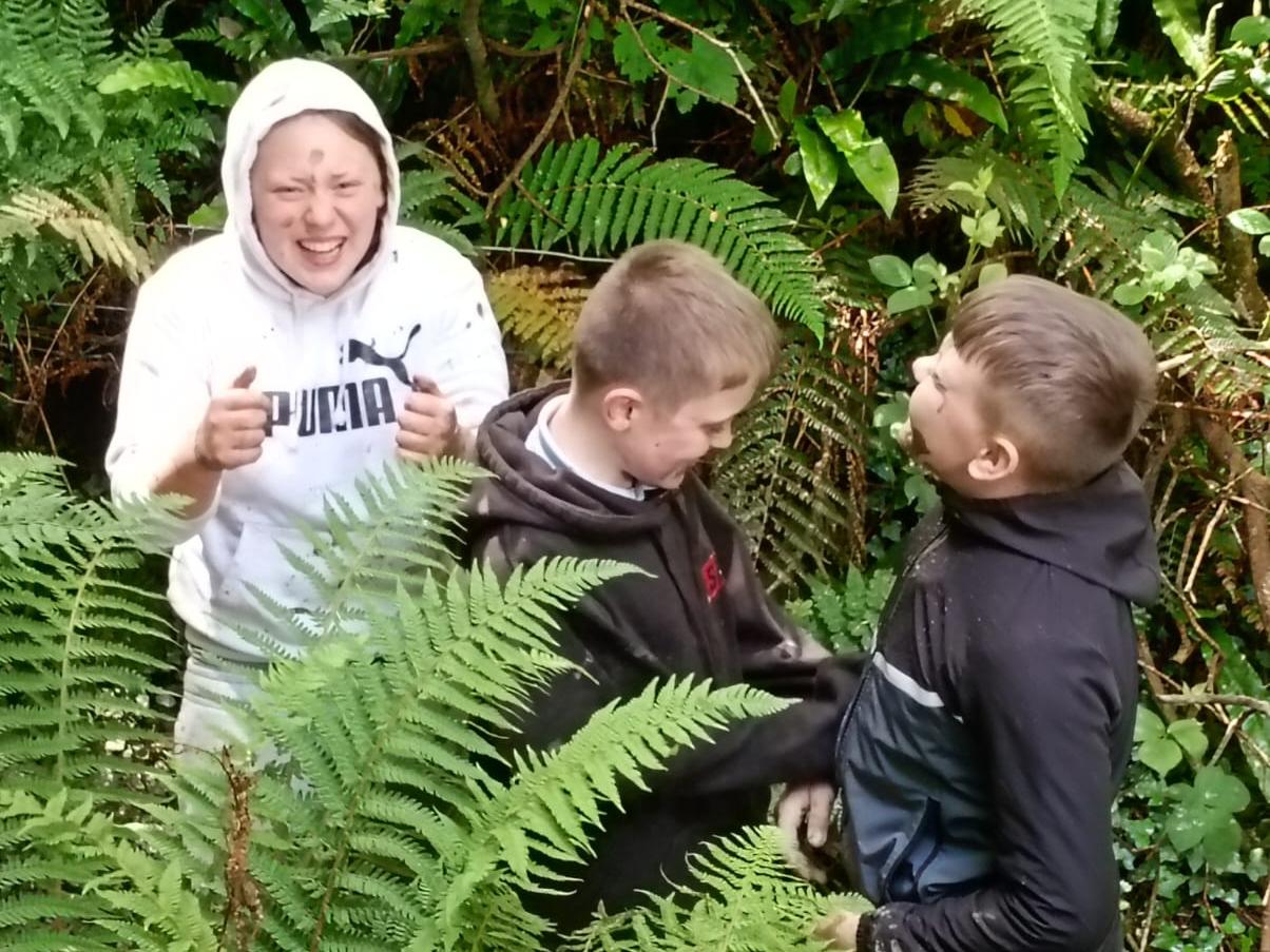 Students collecting more clay from the stream bed