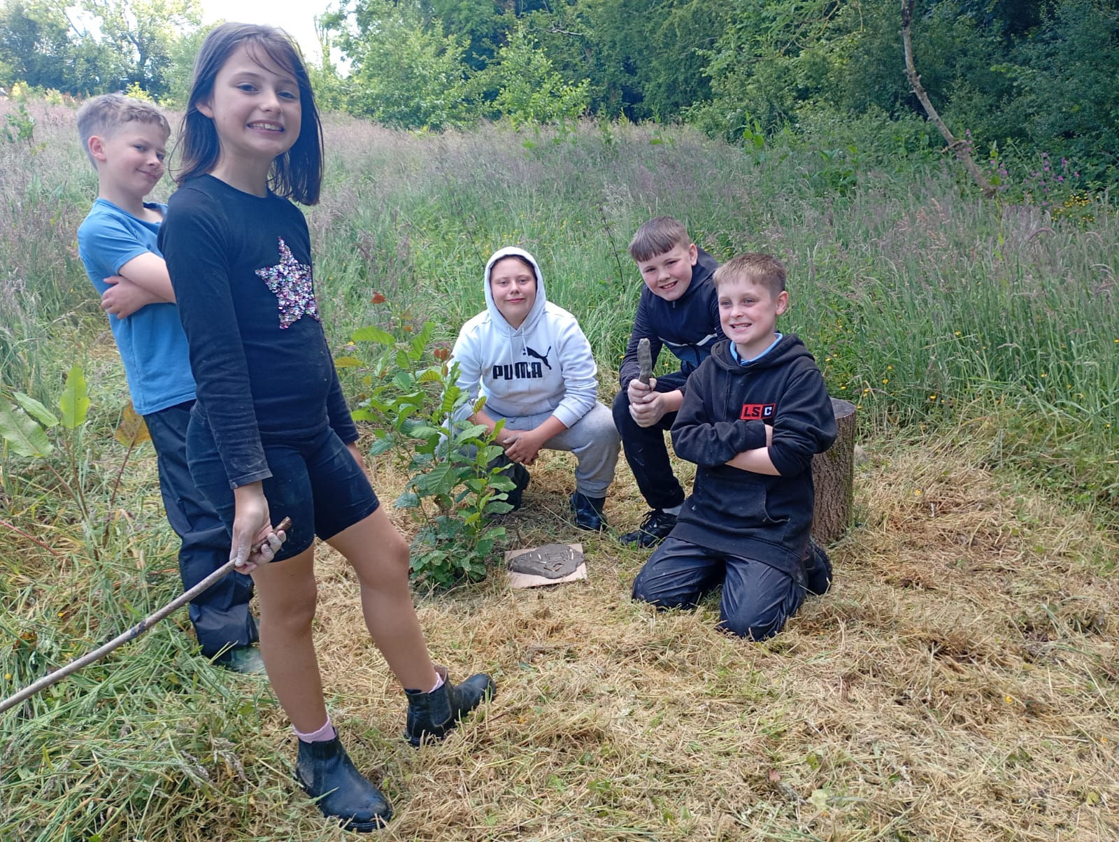 Students with their clay creations taking a break