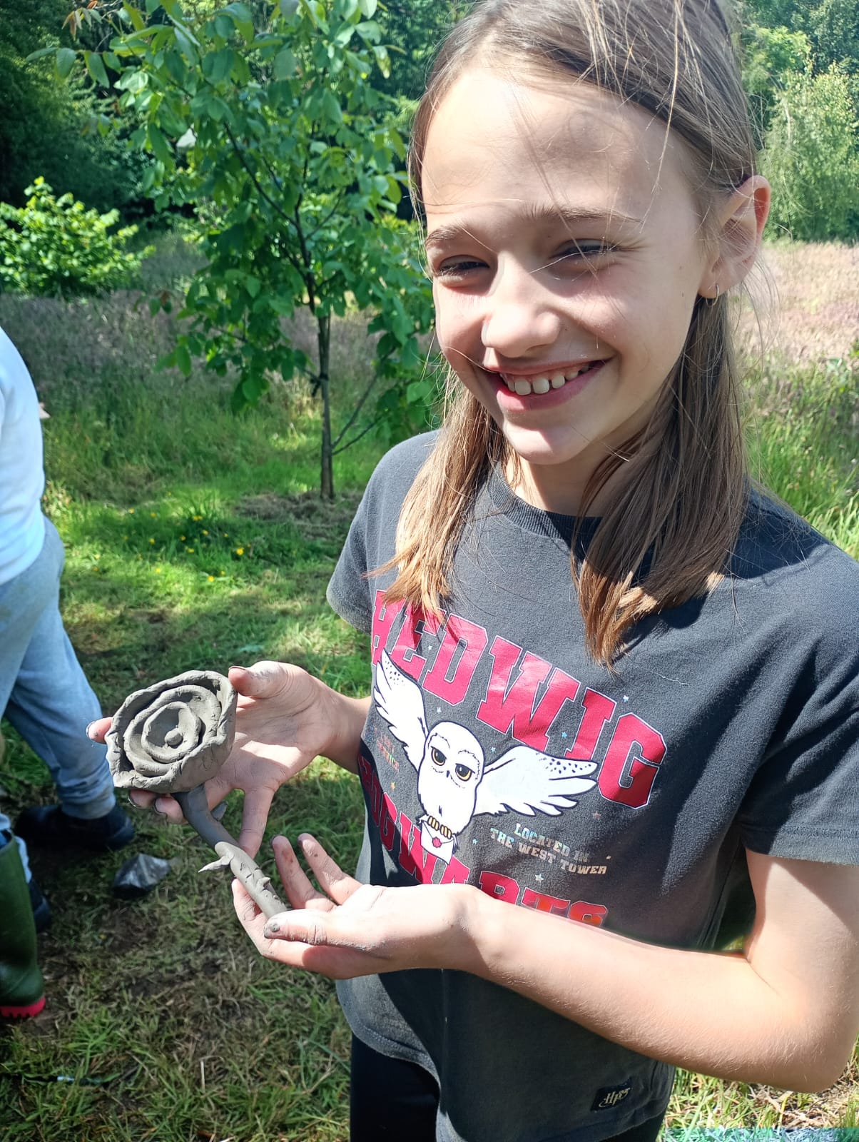 Happy student with clay rose