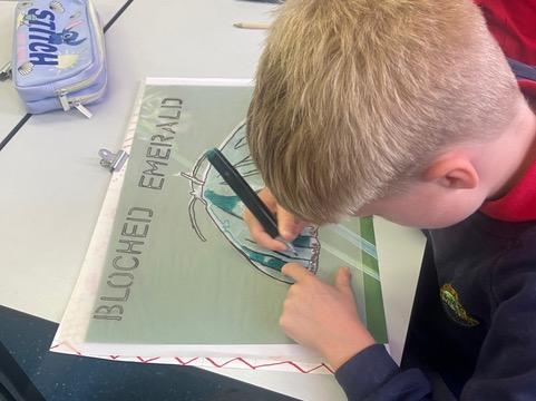 Student tracing the Blotched Emerald moth