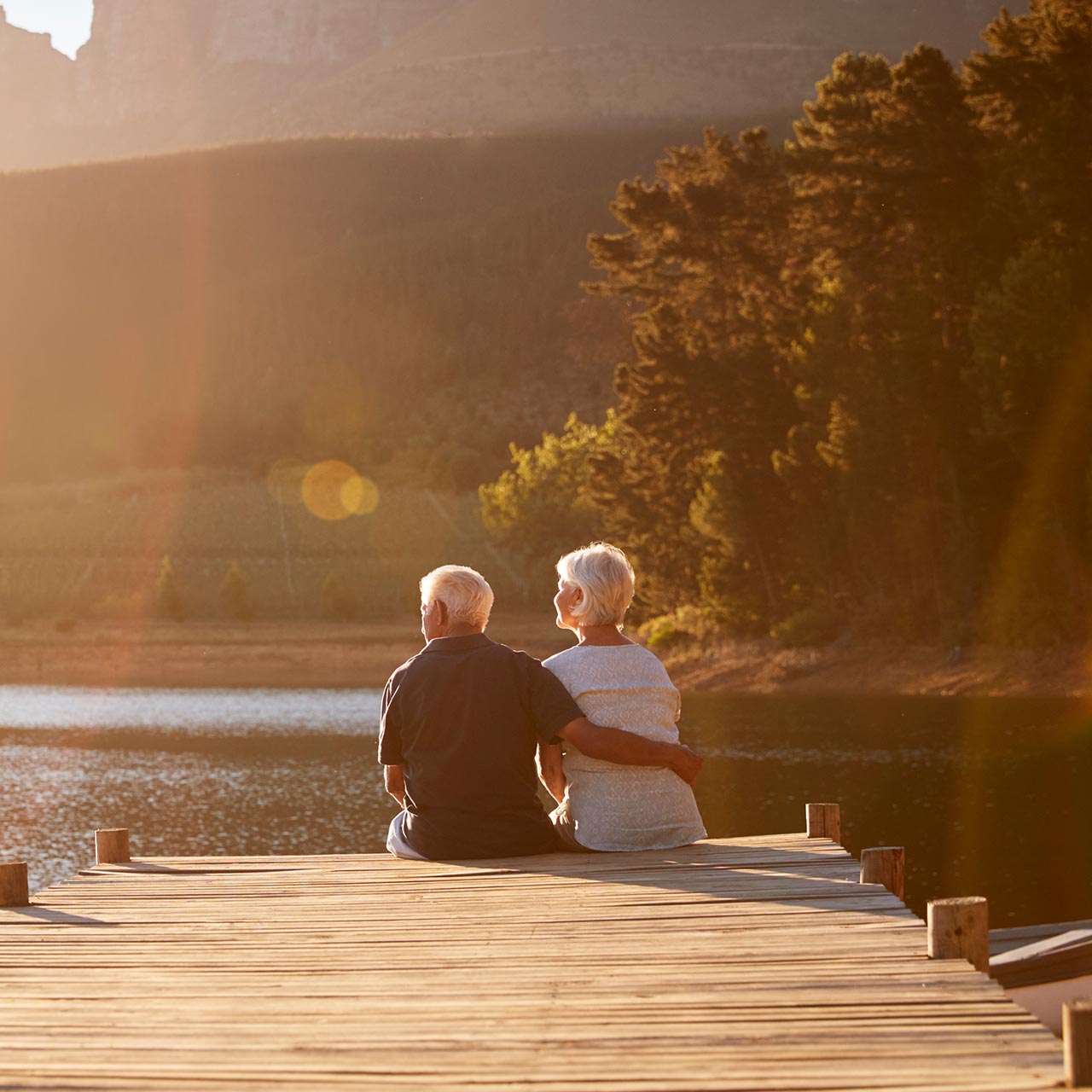 Couple on a dock at sunset