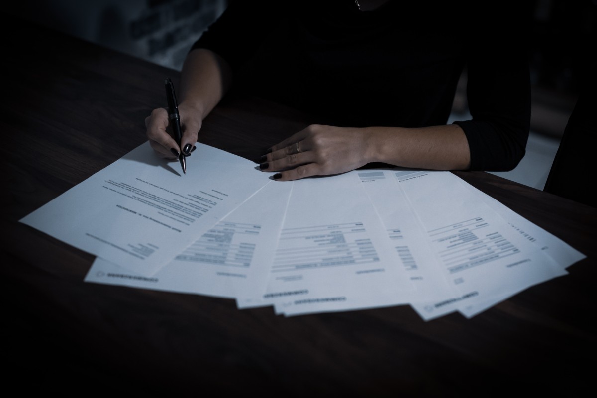 man shifting through tax papers