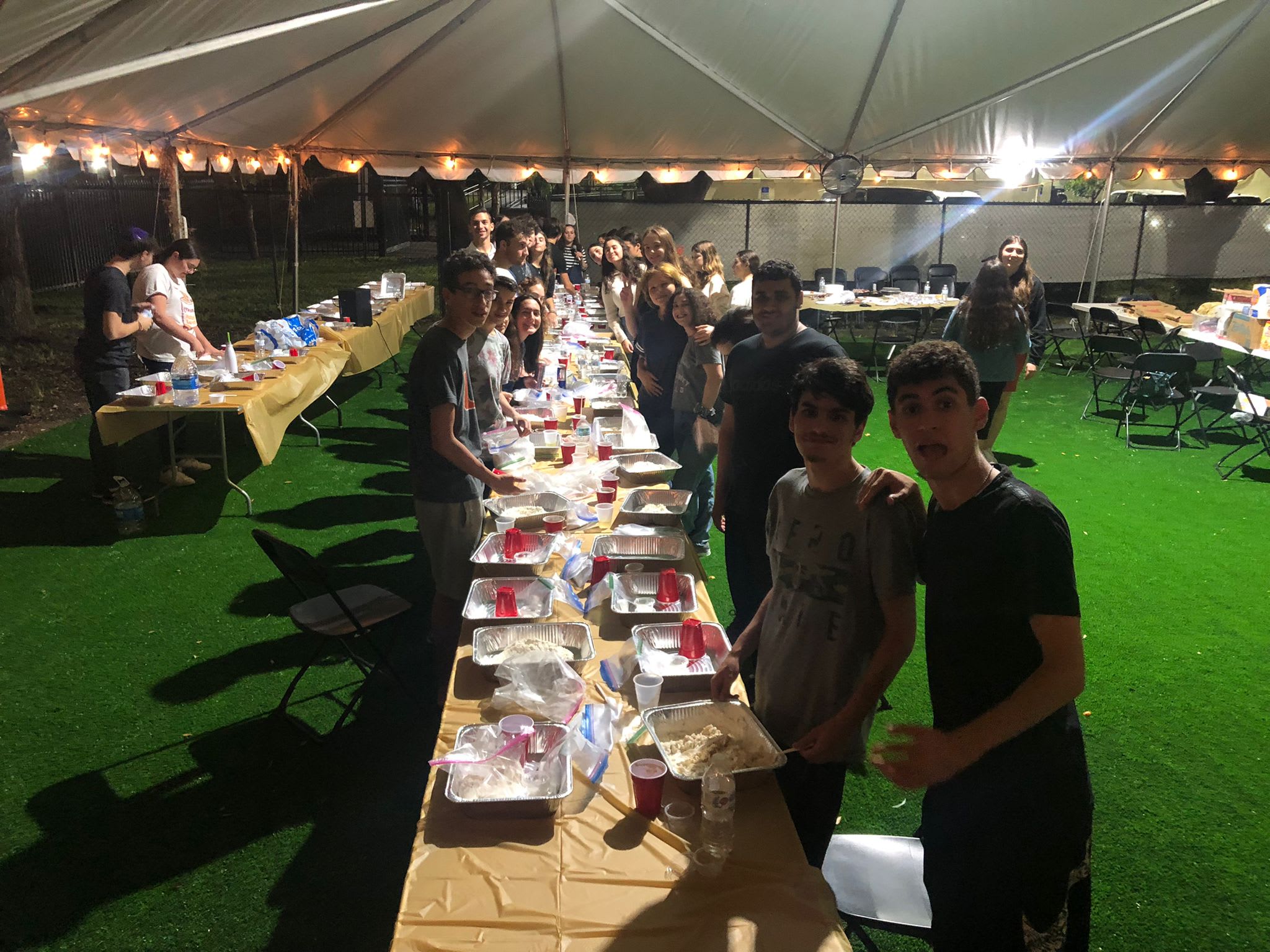 Shevet Glaubach fellows and teens rolling up their sleeves at the Hollywood Challah bake