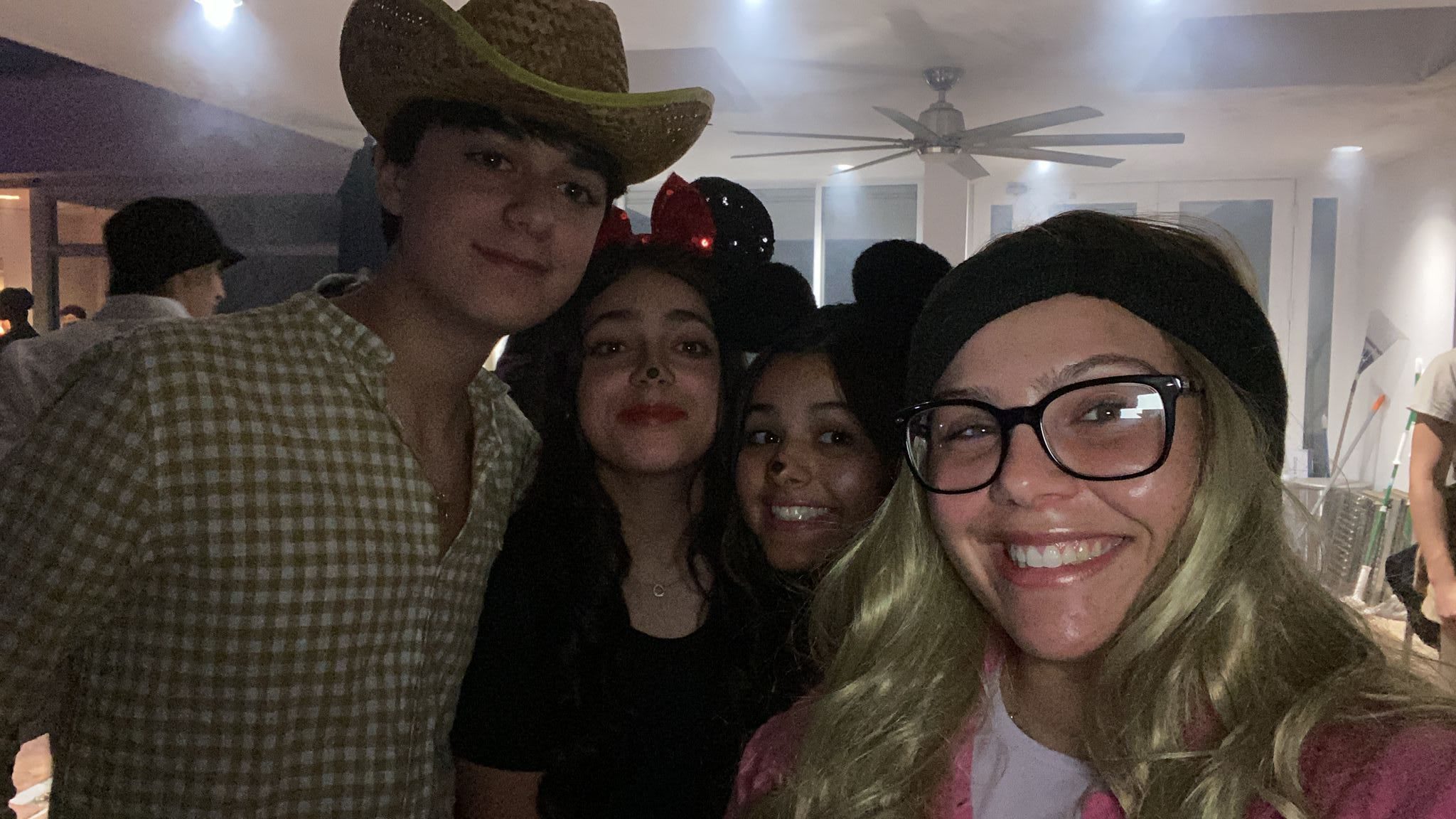 Fellows and teens celebrating Purim with a costume party