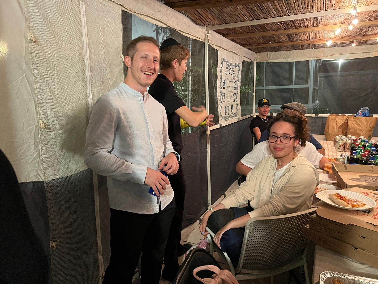 Southern Fellows and teens spending time in the Sukkah