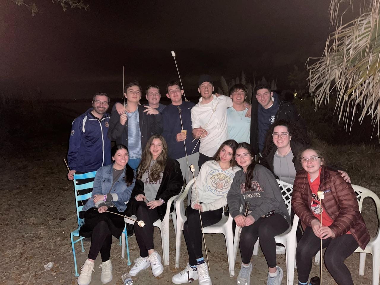 Savannah teens and Fellows having a bonfire and kumtzit
