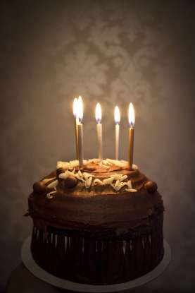 1. "The cake, ____ had candles on top, was made of chocolate." Which word is grammatically correct to use in this sentence?