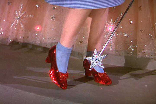 1. Dorothy taps her shoes how many times to do what?
