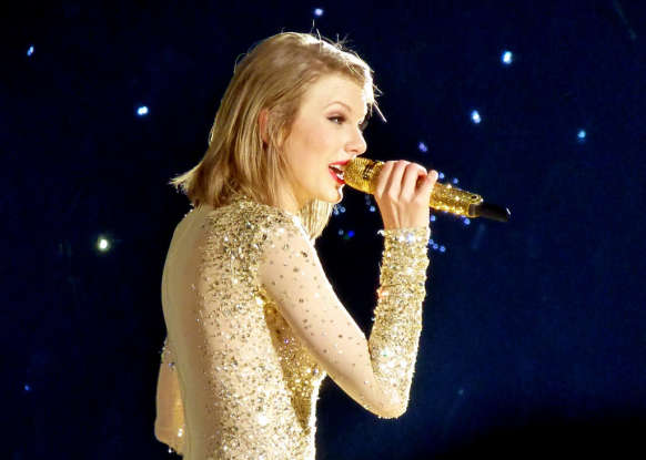 8. Complete the lyrics from "You Belong With Me": "She wears high heels / I wear" what?