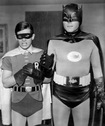 9. Which 60s show features two crime-fighting superheroes defending Gotham?