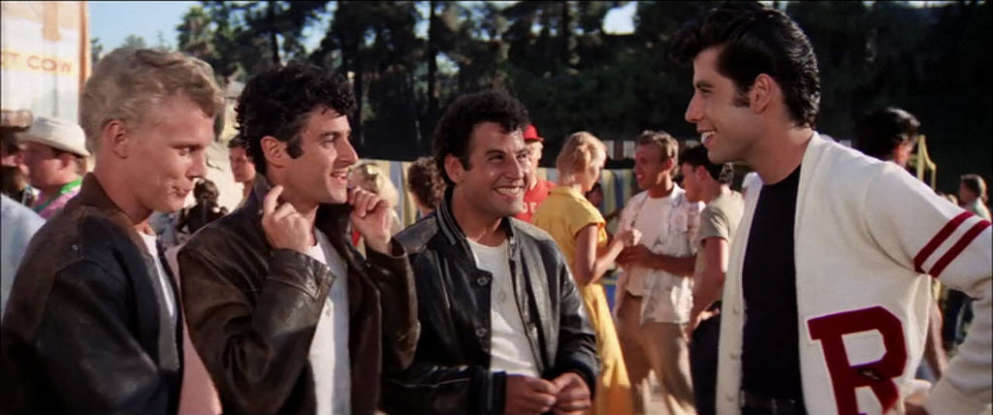 8. Danny eventually joins which sport to impress Sandy?