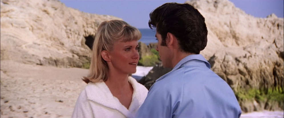 22. Danny and Sandy think they might not see each other again. This is because Sandy is originally from where?