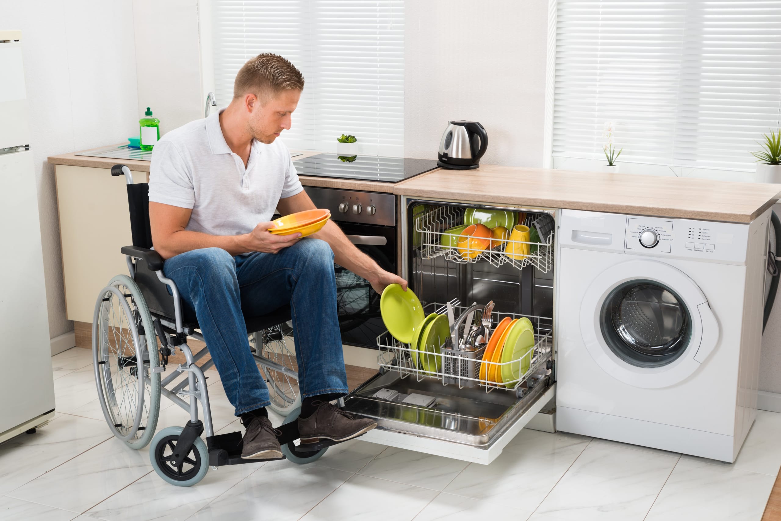 Disabled Man Working In Kitchen Disabled Man Working In Kitchen