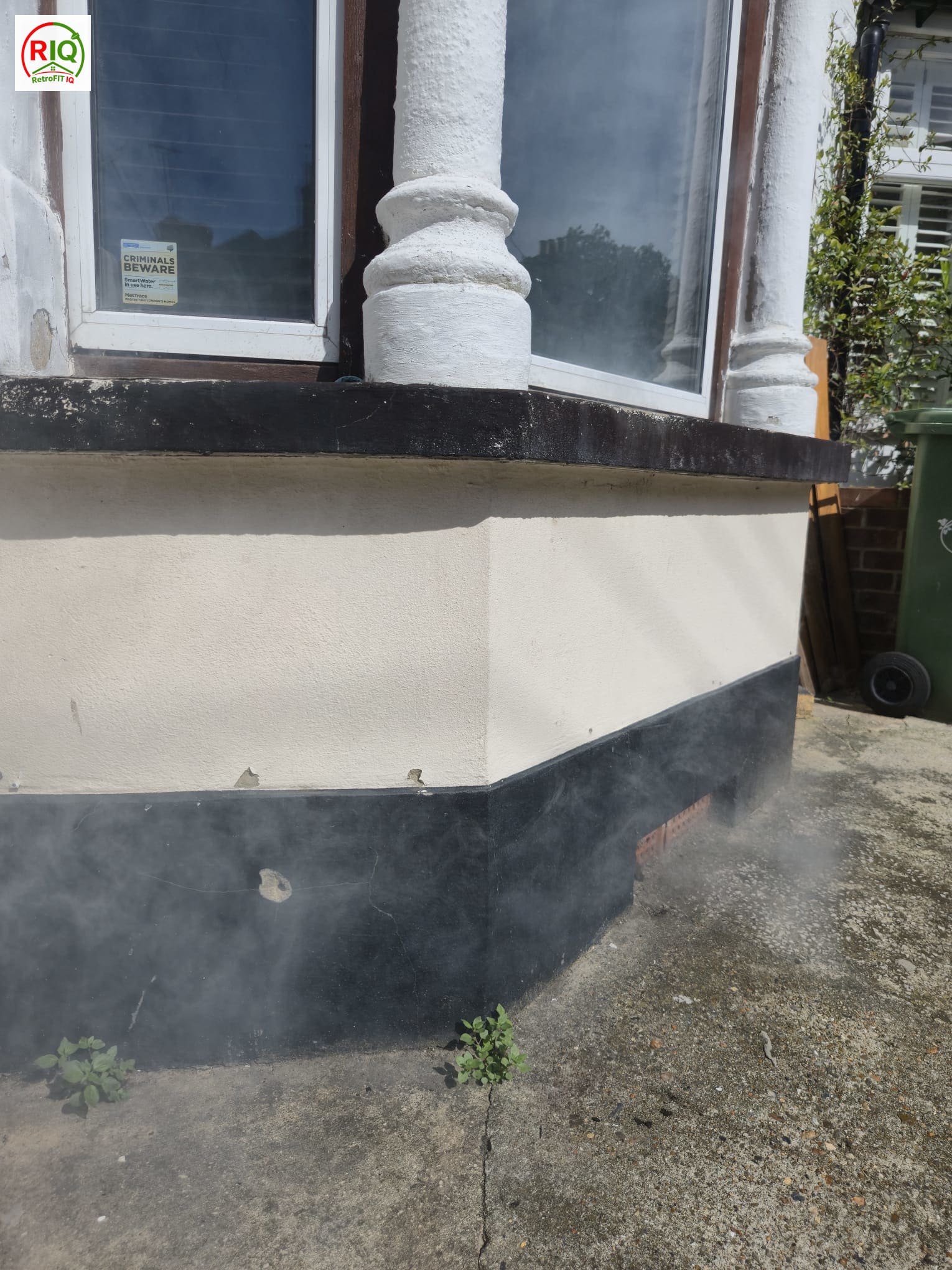 Smoke testing revealing air-leakage paths around a bay window perimeter and frame junctions